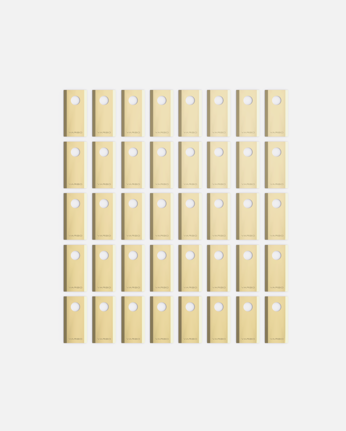 Forty gold metallic cutting blades and bolts by YARBO, arranged in a uniform grid, each piece featuring a circular hole.