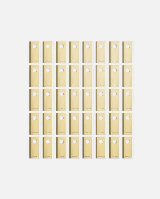 Forty gold metallic cutting blades and bolts by YARBO, arranged in a uniform grid, each piece featuring a circular hole.