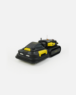 Black and yellow Mini Lawn Mower 3D Model by Yarbo, with tracked wheels and antennas, viewed from the side.