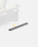 Dark gray scraper bar by Yarbo with multiple screws, shown with a yellow arrow pointing from a blurred machine.